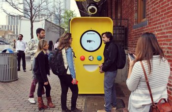 Snapchat Spectacles machine and people outside