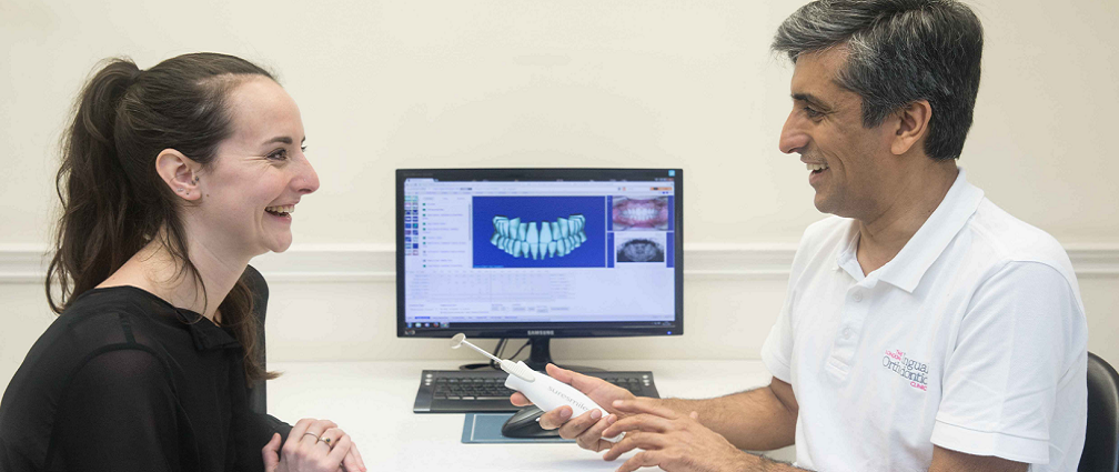 Dr Asif Chatoo explains Suresmile to a patient