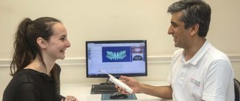 Dr Asif Chatoo and patient with Suresmile technology and visuals