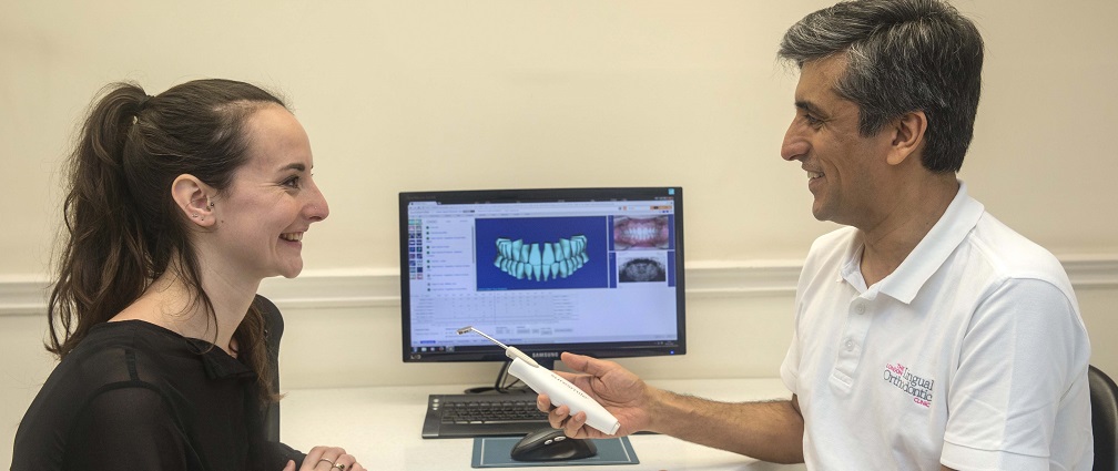 Dr Asif Chatoo and patient with Suresmile technology and visuals