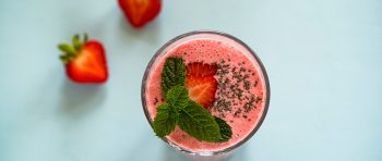 A healthy pink smoothie with strawberry and mint
