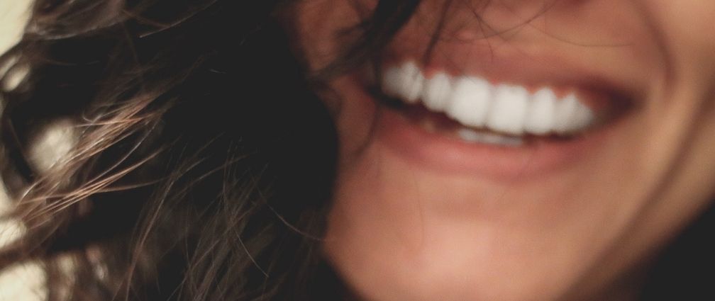 A close up of a smiling lady